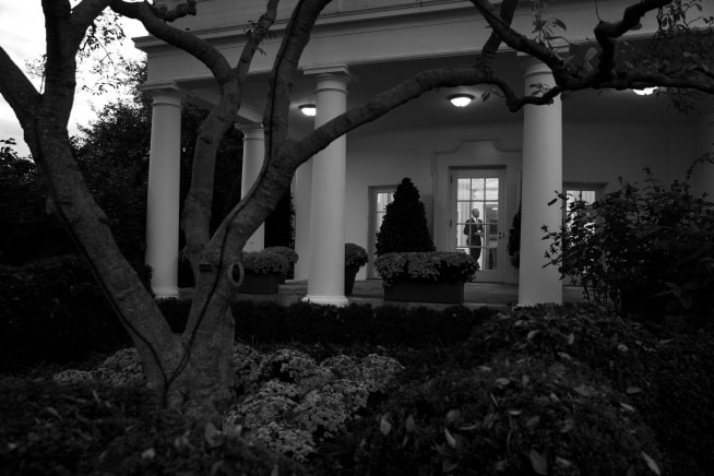 President Obama is seen from the Rose Garden walking through the Oval Office. White House official photo by Pete Souza.